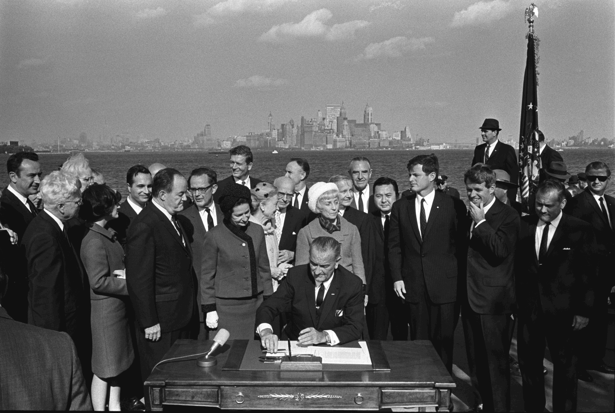 President Lyndon Johnson signs the Immigration and Nationality Act on Liberty Island in 1965
